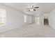 Spacious living room with natural light and a sliding glass door to the backyard at 1903 Windy Hill Ln, Indianapolis, IN 46239