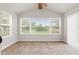 Cozy sunroom filled with natural light and vaulted ceilings at 1903 Windy Hill Ln, Indianapolis, IN 46239