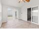 Bright sunroom with tiled floors and access to the backyard at 1903 Windy Hill Ln, Indianapolis, IN 46239