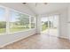Inviting sunroom with large windows offering outdoor views at 1903 Windy Hill Ln, Indianapolis, IN 46239