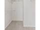 A walk-in closet with carpeted floor, shelving, and ample storage space at 1903 Windy Hill Ln, Indianapolis, IN 46239