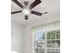 Bright bedroom featuring a ceiling fan and a large window with natural light at 19146 Carol Cove Cir, Noblesville, IN 46062