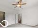 This bedroom has neutral walls, two doors, and a ceiling fan at 19146 Carol Cove Cir, Noblesville, IN 46062