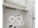 Efficient laundry area with upper cabinets and laundry accessories at 19146 Carol Cove Cir, Noblesville, IN 46062