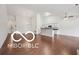 Bright open living space boasts a vaulted ceiling, hardwood floors, and natural light at 19146 Carol Cove Cir, Noblesville, IN 46062