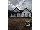 New construction home featuring classic architecture and large windows at 1960 Delp Ct, Avon, IN 46123