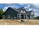 Side view of the new home featuring detailed trim and well-placed windows at 1960 Delp Ct, Avon, IN 46123