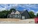 View of the new home displaying an attached garage and complementary exterior colors at 1960 Delp Ct, Avon, IN 46123