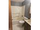 The home features a standard full bathroom with tub and shower, tile floors, and vanity at 2017 Schwier Ct, Indianapolis, IN 46229