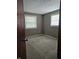 Bedroom with two windows and doorway with open door at 2017 Schwier Ct, Indianapolis, IN 46229
