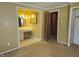 Bedroom with ensuite bathroom and closet with doorways at 2017 Schwier Ct, Indianapolis, IN 46229