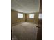 Spacious bedroom with two windows offering great natural light and neutral wall color at 2017 Schwier Ct, Indianapolis, IN 46229