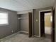 Bedroom with open closet and window with blinds at 2017 Schwier Ct, Indianapolis, IN 46229