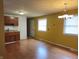 Kitchen with wood cabinets, laminate countertop, tile backsplash, and lighting fixture at 2017 Schwier Ct, Indianapolis, IN 46229