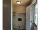 Functional mud room featuring shelving for storage and an exterior door leading outside at 2017 Schwier Ct, Indianapolis, IN 46229