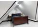 Attic bedroom featuring new carpet, and dark wood bed at 2158 S Garfield Dr, Indianapolis, IN 46203