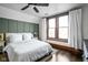Comfortable bedroom with wood floors, and wainscotting at 2158 S Garfield Dr, Indianapolis, IN 46203