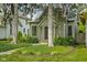 Charming home with mature trees, lush landscaping, and a welcoming front entrance at 2158 S Garfield Dr, Indianapolis, IN 46203