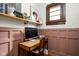 Home office setup with a desk, chair, and shelving, ideal for remote work at 2158 S Garfield Dr, Indianapolis, IN 46203