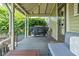 Covered porch with comfortable seating, ideal for enjoying the outdoors at 2158 S Garfield Dr, Indianapolis, IN 46203