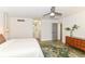 Bright bedroom with neutral decor, ceiling fan, and lots of closet space at 2433 Hideaway S Dr, Indianapolis, IN 46268