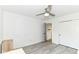 Neutral bedroom with gray flooring, a ceiling fan, and a closet, offering a clean and simple design at 2433 Hideaway S Dr, Indianapolis, IN 46268