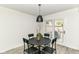 Dining room featuring a round table, four chairs, and a sliding door to the backyard, perfect for casual meals at 2433 Hideaway S Dr, Indianapolis, IN 46268
