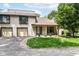 Inviting two-story townhome with attached garage and well-maintained front lawn at 2433 Hideaway S Dr, Indianapolis, IN 46268