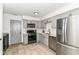 Modern kitchen with stainless steel appliances, subway tile backsplash and gray cabinets at 2433 Hideaway S Dr, Indianapolis, IN 46268