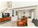 Bright living room boasting high ceilings, a staircase, and modern furnishings at 2433 Hideaway S Dr, Indianapolis, IN 46268