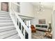 Open concept living room with staircase and soaring ceilings at 2433 Hideaway S Dr, Indianapolis, IN 46268
