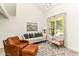 Airy living room with vaulted ceilings and a large window for natural light at 2433 Hideaway S Dr, Indianapolis, IN 46268