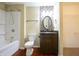 Well-lit bathroom featuring modern vanity with granite countertop and decorative mosaic backsplash at 2434 Harvest Moon Dr, Greenwood, IN 46143
