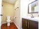 Cozy bathroom showcasing wood-look flooring, toilet, vanity, and walk-in shower at 2434 Harvest Moon Dr, Greenwood, IN 46143