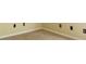 Close up of bedroom corner showing carpet and several electrical outlets at 2434 Harvest Moon Dr, Greenwood, IN 46143