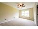 Bright bedroom with neutral carpeting, ample natural light, and modern ceiling fan at 2434 Harvest Moon Dr, Greenwood, IN 46143