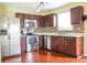 Well-equipped kitchen with stainless steel appliances, modern cabinets, and mosaic backsplash at 2434 Harvest Moon Dr, Greenwood, IN 46143