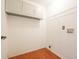 Well-lit laundry room with vinyl flooring, upper cabinets and washer/dryer hookups at 2434 Harvest Moon Dr, Greenwood, IN 46143
