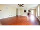 Expansive living room with rich wood-look flooring and ample natural light at 2434 Harvest Moon Dr, Greenwood, IN 46143
