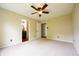 Spacious main bedroom features plush carpeting and ensuite bathroom access at 2434 Harvest Moon Dr, Greenwood, IN 46143
