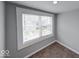 Bedroom featuring carpet, light-colored walls, and a window with blinds at 244 W 31St St, Indianapolis, IN 46208