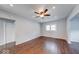 Bright living room featuring hardwood floors, ceiling fan, and natural light from a window at 244 W 31St St, Indianapolis, IN 46208