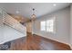 Open-concept living room boasts hardwood floors, natural light, and a modern staircase at 244 W 31St St, Indianapolis, IN 46208