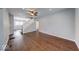 Well-lit living area with hardwood floors, a staircase, and access to other rooms at 244 W 31St St, Indianapolis, IN 46208