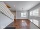 Inviting living room showcases hardwood floors, natural light, and modern staircase design at 244 W 31St St, Indianapolis, IN 46208