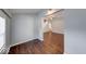 Inviting living area with hardwood floors, a staircase, and access to other rooms at 244 W 31St St, Indianapolis, IN 46208