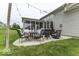 This backyard features a patio with wicker furniture under string lights at 2502 Colinbrook Pkwy, Greenwood, IN 46143