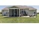 Outdoor living area complete with screened-in porch, hot tub, and patio furniture for relaxation and entertainment at 2502 Colinbrook Pkwy, Greenwood, IN 46143