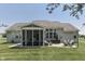 Home exterior features a screened porch, hot tub, large windows, and spacious patio for outdoor enjoyment at 2502 Colinbrook Pkwy, Greenwood, IN 46143