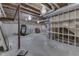 Unfinished basement with exposed ceiling, shelving, and decorative lighting provides opportunity for a personalized design at 2502 Colinbrook Pkwy, Greenwood, IN 46143